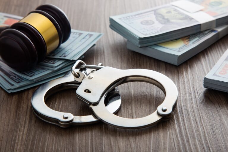 Money and handcuffs. Concept for corruption, fraud and money laundry